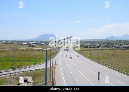 The road crossing is adjacent to the secondary road. Stock Photo