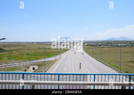 The road crossing is adjacent to the secondary road. Stock Photo