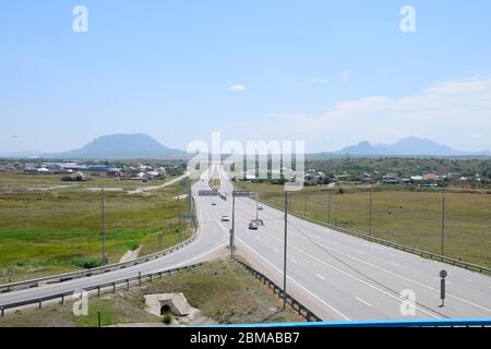 The road crossing is adjacent to the secondary road. Stock Photo