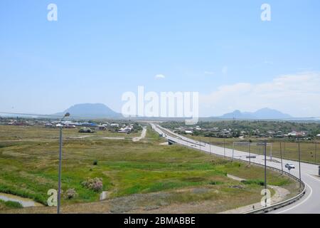 The road crossing is adjacent to the secondary road. Stock Photo