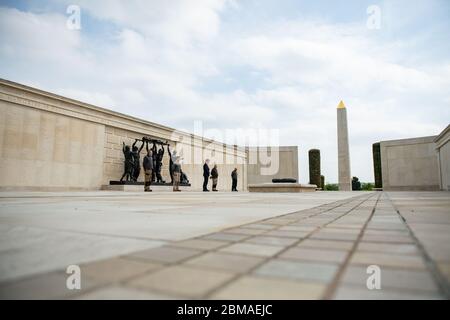 Staff at the deserted National Memorial Arboretum in Alrewas, Staffordshire, observe a two minutes' silence to commemorate the 75th anniversary of VE Day. Mark Ellis, head of visitor experience, laid a wreath. Normally the Arboretum would welcome around 10,000 visitors to mark such an occasion. Stock Photo