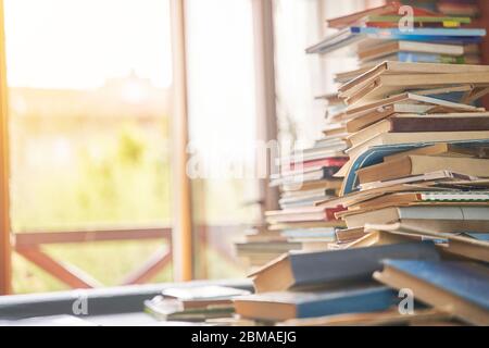 Pile of old books on the table. Lots of old books. Copy space Stock Photo
