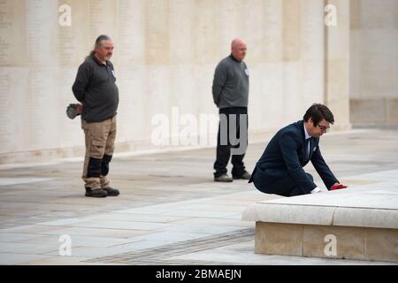 Staff at the deserted National Memorial Arboretum in Alrewas, Staffordshire, observe a two minutes' silence to commemorate the 75th anniversary of VE Day. Mark Ellis, head of visitor experience, laid a wreath. Normally the Arboretum would welcome around 10,000 visitors to mark such an occasion. Stock Photo