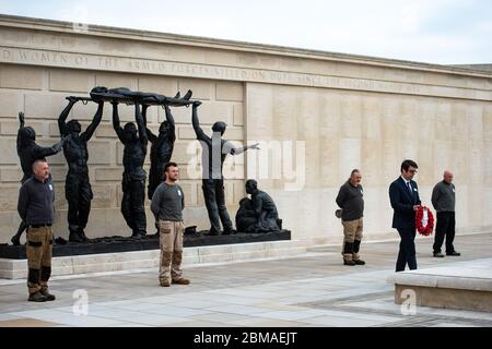 Staff at the deserted National Memorial Arboretum in Alrewas, Staffordshire, observe a two minutes' silence to commemorate the 75th anniversary of VE Day. Mark Ellis, head of visitor experience, laid a wreath. Normally the Arboretum would welcome around 10,000 visitors to mark such an occasion. Stock Photo