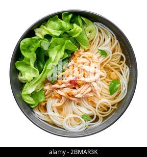 Guay Tiew Gai Cheek or Thai Chicken Noodle Soup in black bowl isolated on white backdrop. Guay Tiew Gai is Thailand cuisine soup with rice noodles, ch Stock Photo