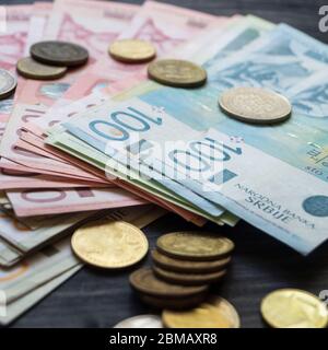 Serbian money dinar, pile of coins on wooden table, close up Stock Photo