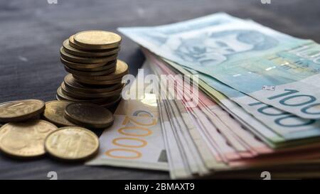 Serbian money dinar, pile of coins on wooden table, close up Stock Photo