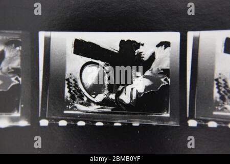 Fine 70s vintage contact print black and white extreme photography of an air traffic controller watching a radar screen monitor. Stock Photo