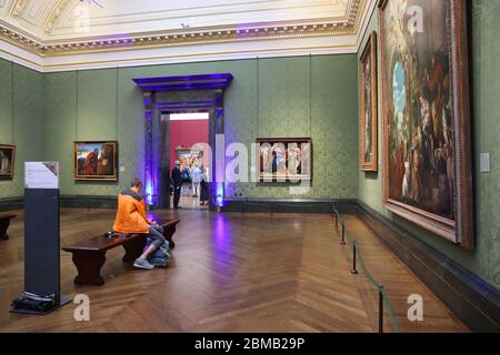 LONDON, UK - JULY 12, 2019: Tourists visit National Gallery in London. It is the 3rd most visited museum in the UK with 5.7 million annual visitors. Stock Photo