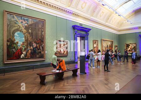 LONDON, UK - JULY 12, 2019: Tourists visit National Gallery in London. It is the 3rd most visited museum in the UK with 5.7 million annual visitors. Stock Photo