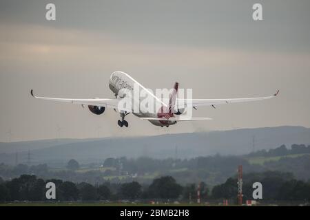 Glasgow, UK. 25 August 2019.  Pictured: Virgin Atlantic Airbus A350-1000 aircraft seen at Glasgow International Airport for pilot training. Virgin's brand new jumbo jet boasts an amazing new 'loft' social space with sofas in business class, and aptly adorned by the registration G-VLUX. The entire aircraft will also have access to high-speed Wi-Fi. Virgin Atlantic has ordered a total of 12 Airbus A350-1000s. They are all scheduled to join the fleet by 2021 in an order worth an estimated $4.4 billion (£3.36 billion). Credit: Colin Fisher/Alamy Live News.