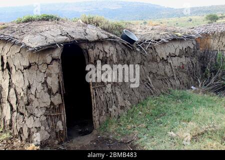 Traditional Maasai (Masai) hut is constructed from applying mud to a lattice framework of reeds Photographed in Kenya Stock Photo