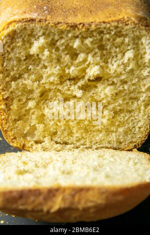 Fresh fragrant bread against a dark background. Assortment of baked bread on dark table background. Fresh fragrant bread on the table. Front views Stock Photo