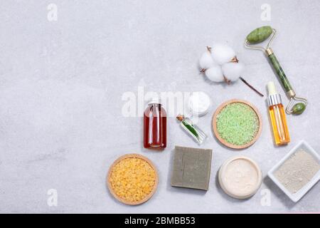 Spa product composition with sea salt and natural cosmetic at light stone table. Flat lay. copy space. Stock Photo