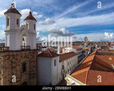 Sucre Bolivia : Red roofs of  bolivian white city centre  colonial architecture cloudy day dramatic sky Stock Photo
