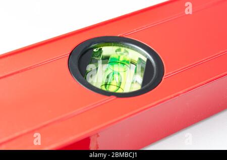 Close-up   angle  view of   red   Spirit Levels  used in construction on white  background  . Stock Photo