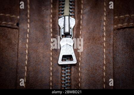 Zip fastener on a brown leather motorcycle jacket Stock Photo