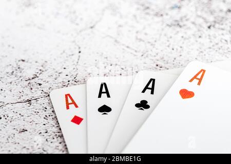 Four aces of different suits isolated on white background Stock Photo