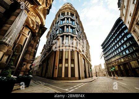Wide angle architectural shot of the empty City of London; 1 Threadneedle Street building in the centre. Day 7 of the lockdown, London, UK. Mar 2020 Stock Photo