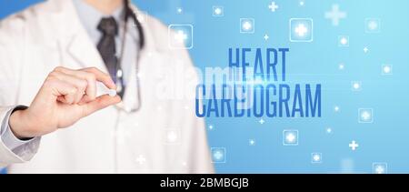 Close-up of a doctor giving a pill with HEART CARDIOGRAM inscription, medical concept Stock Photo