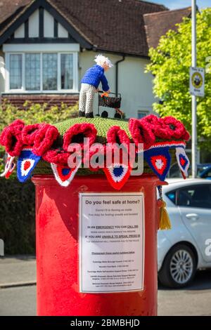 Tunbridge Wells, Kent, UK. 8th May, 2020. A mystery local person has adorned the post box in Wilman Road with a knitted & crochet 'hat' to commemorate VE day 75th anniversary, and honour Captain Tom Moore fundraising efforts and birthday Credit: Sarah Mott/Alamy Live News Stock Photo