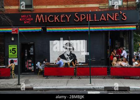 Diners eating outside at Mickey Spillane's, a restaurant in Hell's Kitchen