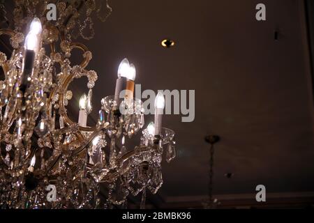 The lights and the reflections of a glass chandelier Stock Photo