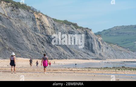 Charmouth Dorset, UK. 8th May, 2020. UK Weather: A hot and sunny bank holiday afternoon at Charmouth, West Dorset. Despite the beautiful weather he beaches remain quiet on the 75th aniversary of VE day as people continue to follow advice to stay at home during the coronavirus pandemic lockdown. Credit: Celia McMahon/Alamy Live News Stock Photo