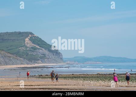 Charmouth Dorset, UK. 8th May, 2020. UK Weather: A hot and sunny bank holiday afternoon at Charmouth, West Dorset. Despite the beautiful weather he beaches remain quiet on the 75th aniversary of VE day as people continue to follow advice to stay at home during the coronavirus pandemic lockdown. Credit: Celia McMahon/Alamy Live News Stock Photo