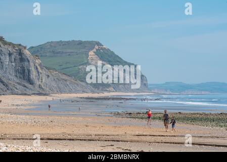 Charmouth Dorset, UK. 8th May, 2020. UK Weather: A hot and sunny bank holiday afternoon at Charmouth, West Dorset. Despite the beautiful weather he beaches remain quiet on the 75th aniversary of VE day as people continue to follow advice to stay at home during the coronavirus pandemic lockdown. Credit: Celia McMahon/Alamy Live News Stock Photo