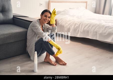 Positive delighted girl looking straight at camera Stock Photo