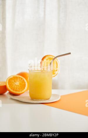 Refreshing Orange Juice with Metal Straw Stock Photo