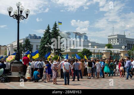 Kyiv , Ukraine- May 25 , 2019:People with flags protest near the parliament building of Ukraine against the law on pensioners in Kyiv , Ukraine Stock Photo