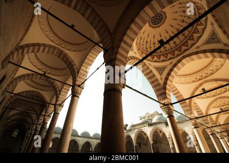 Courtyard of Suleymaniye Mosque with domes, arches and pillars Stock Photo