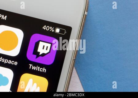 Twitch mobile app icon is seen on a smartphone. Twitch is a video live streaming service operated by Twitch Interactive, a subsidiary of Amazon. Stock Photo