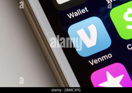 Venmo mobile app icon is seen on a smartphone. Venmo is a mobile payment service owned by PayPal. Stock Photo