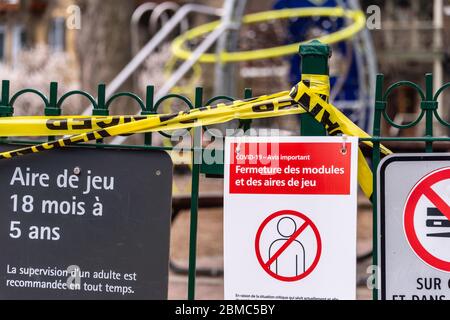 Montreal, CA - 8 May 2020 : a sign alerts residents of Montreal that playgrounds are closed due to COVID-19 pandemic. Stock Photo