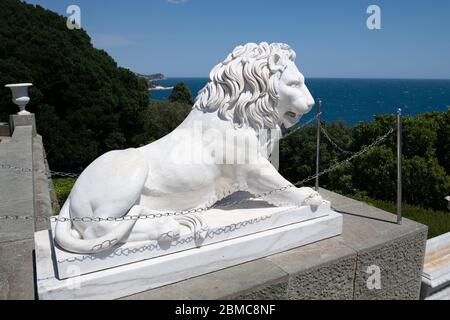 Alupka, Crimea - July 10. 2019. Lion on the porch of the southern facade of the Vorontsov Palace Stock Photo