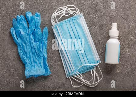 Protective mask, disposable gloves, disinfectant, Second wave. Personal protective equipment for coronavirus Stock Photo