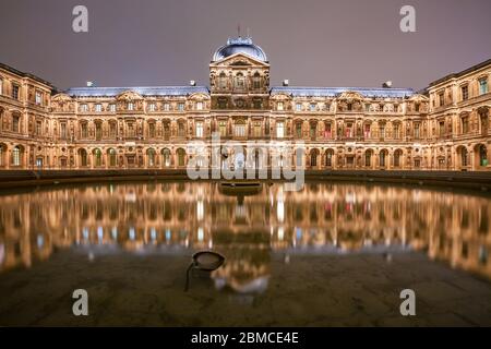 The Louvre Museum in Paris France at night Stock Photo