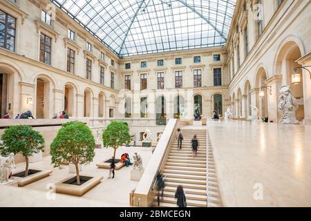 People inside the The Louvre Museum in Paris France Stock Photo