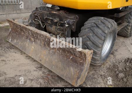 Close up of wheels and blade. Wheel excavator. Stock Photo