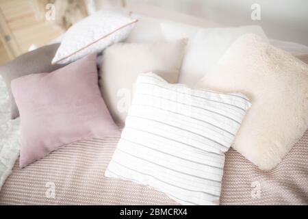 Small square pillows on the sofa. Close up. Stock Photo