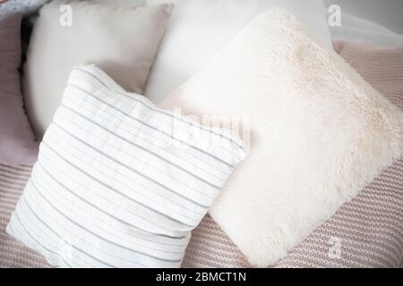 Small square pillows on the sofa. Close up. Stock Photo
