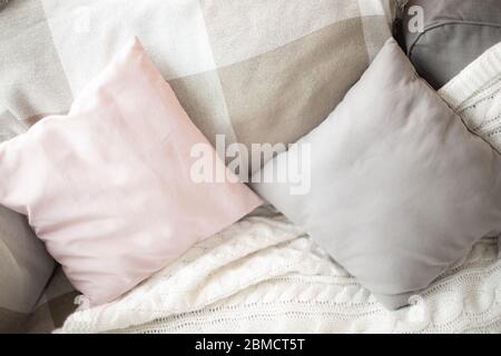 Small square pillows on the sofa. Close up. Stock Photo