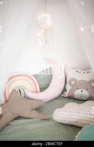 Small square pillows on the sofa. Close up. Stock Photo