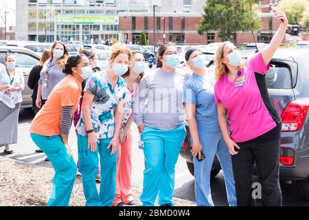 Healthcare workers from the hospital taking a selfie before the Appreciation Parade that was organized to thank all everyone who works at the hospital. Stock Photo