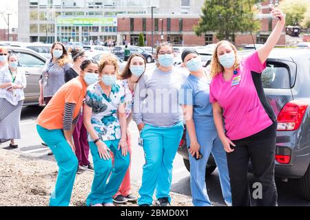 Healthcare workers from the hospital taking a selfie before the Appreciation Parade that was organized to thank all everyone who works at the hospital. Stock Photo