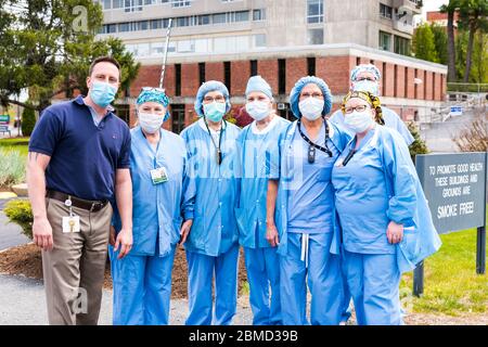 Healthcare workers standing outside of Emerson Hospital after the Appreciation Parade organized by Concord Police to say thank you to everyone there. Stock Photo