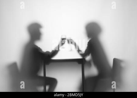 Relationship. Girl, boy at table with wine glass Stock Photo